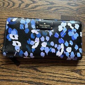 Kate Spade wallet. Navy faux leather with purple and blue flowers.